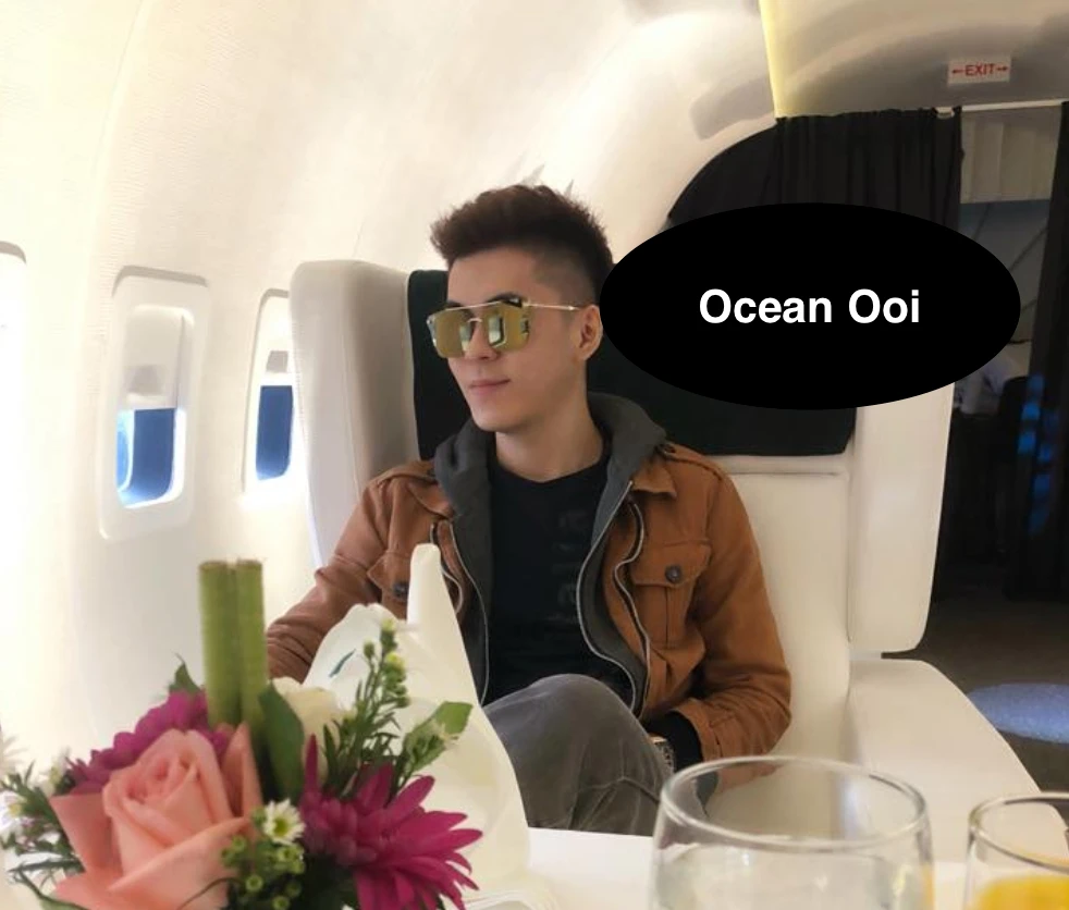 Ocean Ooi seated beside an aircraft window